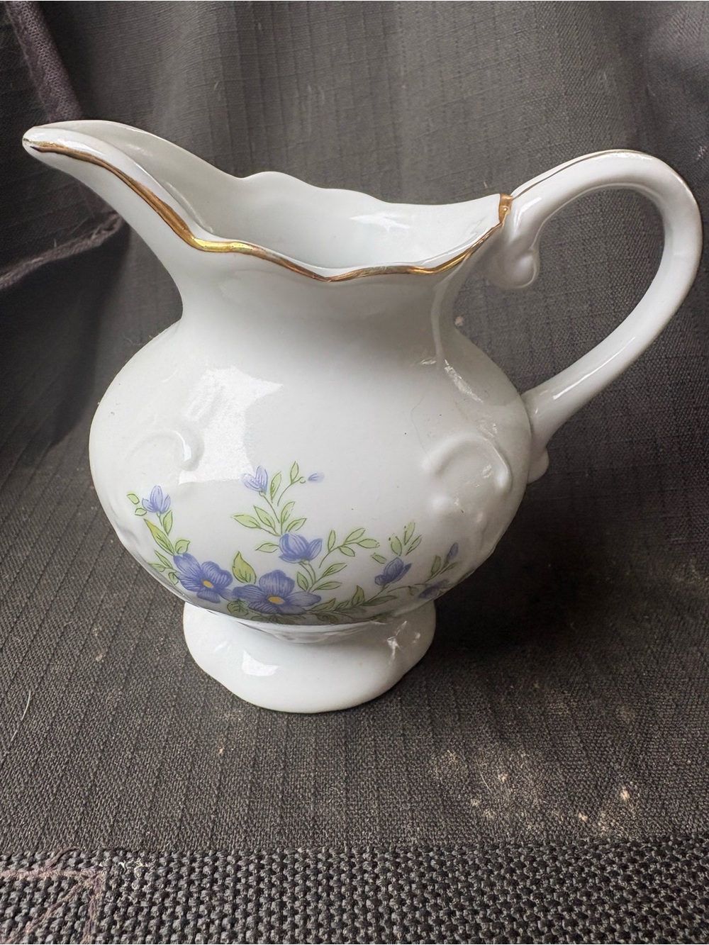 Classic White Porcelain Pitcher with Blue Floral Pattern and Gold Trim